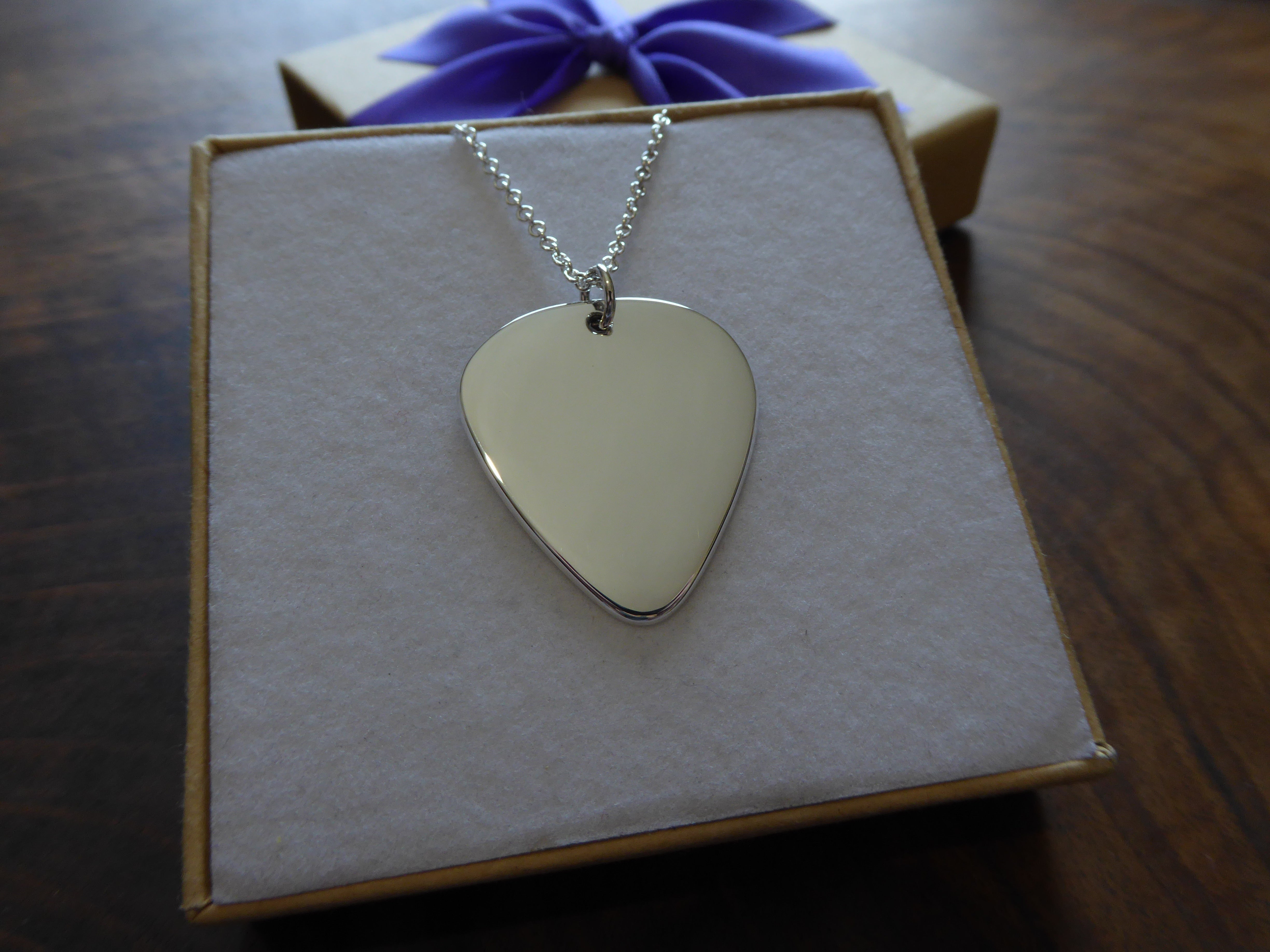 Silver plectrum pendant on sale
